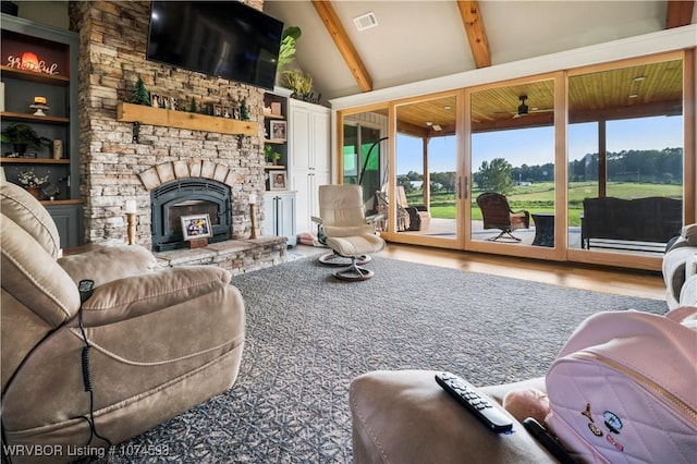 living room with beam ceiling, ceiling fan, built in features, high vaulted ceiling, and wood-type flooring