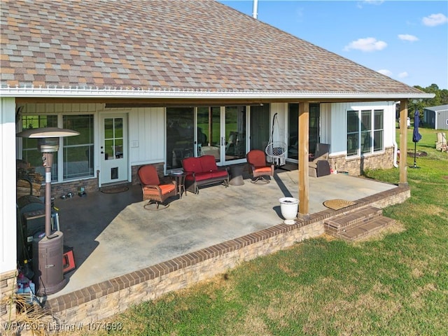 exterior space featuring an outdoor hangout area, a patio, and a lawn