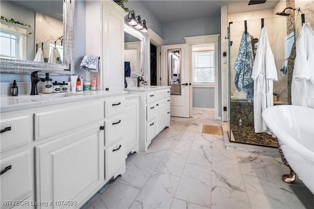 bathroom featuring vanity and separate shower and tub