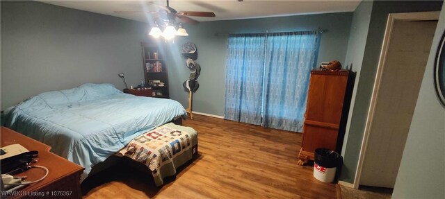 bedroom featuring hardwood / wood-style flooring and ceiling fan