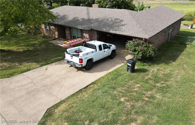 view of front of house featuring a garage and a front lawn