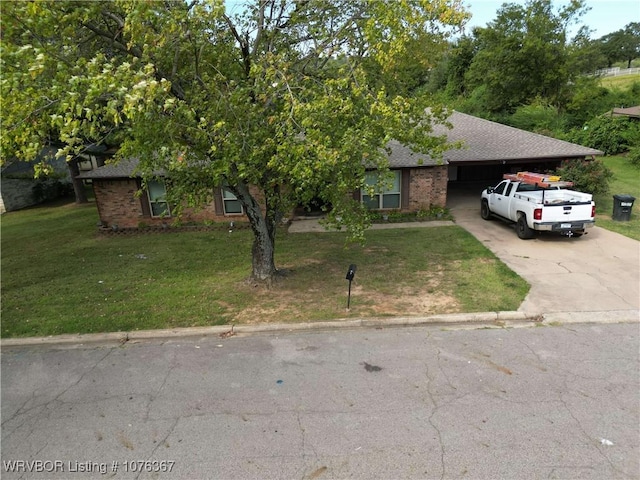 view of front facade featuring a garage and a front lawn