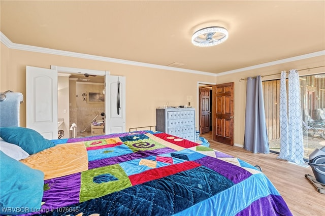 bedroom with crown molding and hardwood / wood-style floors