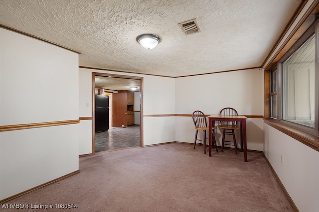 unfurnished room with baseboards, visible vents, and carpet floors