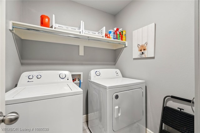 1026 Snow Goose Way, Barling, AR 72923 - washroom with baseboards, laundry area, and washer and clothes dryer
