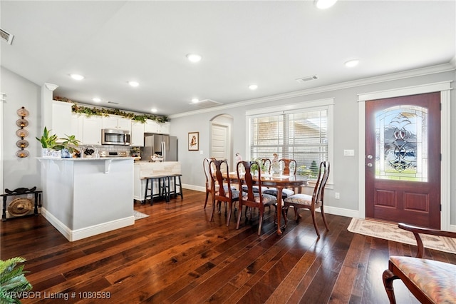 1026 Snow Goose Way, Barling, AR 72923 - dining room featuring visible vents, dark wood-type flooring, baseboards, and crown molding