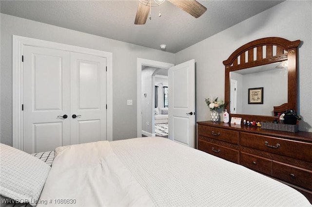 bedroom featuring ceiling fan and a closet