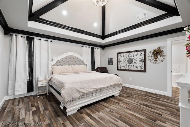 bedroom with baseboards, visible vents, and wood finished floors
