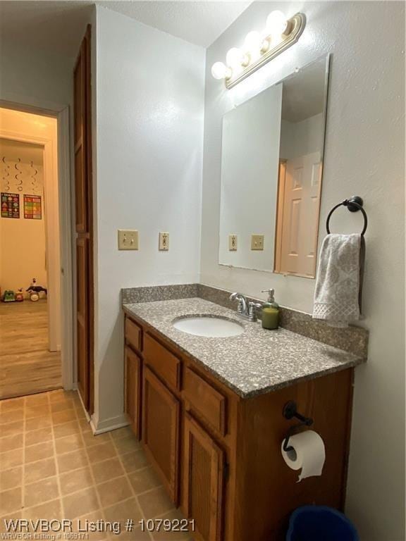 bathroom with vanity and tile patterned floors