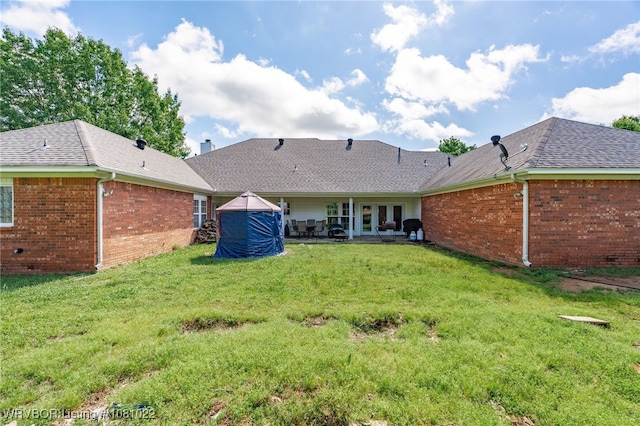 25 Shibley Rd, Van Buren, AR 72956 - rear view of house with french doors, a patio, a yard, and brick siding