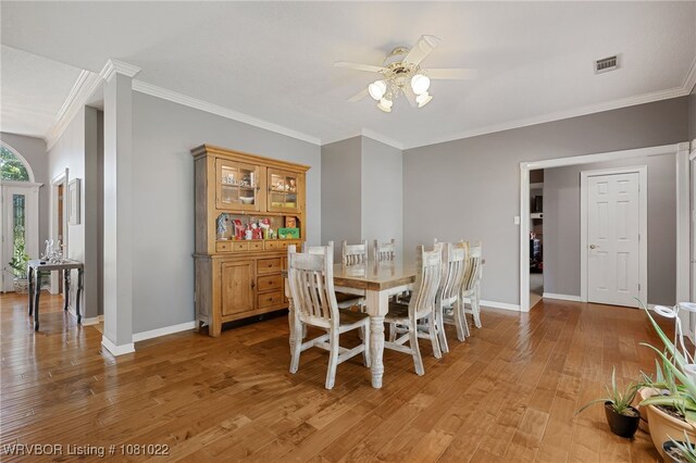 25 Shibley Rd, Van Buren, AR 72956 - dining room featuring a ceiling fan, crown molding, light wood-type flooring, and baseboards