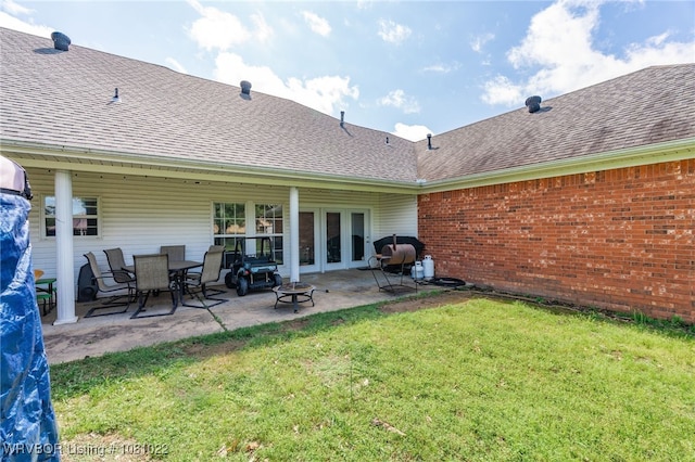 25 Shibley Rd, Van Buren, AR 72956 - rear view of house with a shingled roof, a yard, a patio area, and brick siding