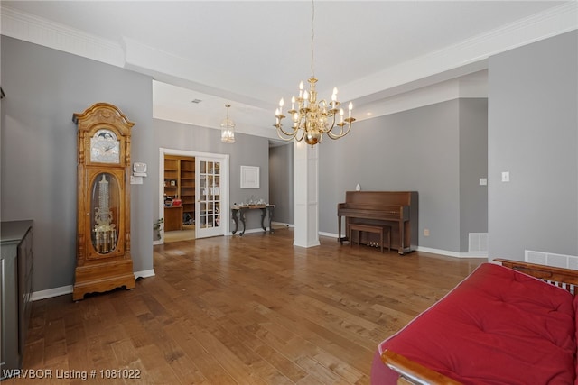 25 Shibley Rd, Van Buren, AR 72956 - living area featuring wood finished floors, a chandelier, baseboards, and ornamental molding
