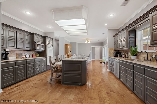 25 Shibley Rd, Van Buren, AR 72956 - kitchen with a sink, stainless steel appliances, light wood finished floors, tasteful backsplash, and recessed lighting