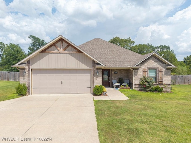 1024 Mourning Dove Way, Barling, AR 72923 - view of front facade featuring brick siding, an attached garage, driveway, and a shingled roof