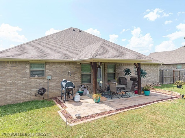 1024 Mourning Dove Way, Barling, AR 72923 - rear view of house with roof with shingles, a patio area, and brick siding