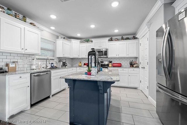 1024 Mourning Dove Way, Barling, AR 72923 - kitchen with appliances with stainless steel finishes, tasteful backsplash, white cabinets, and recessed lighting