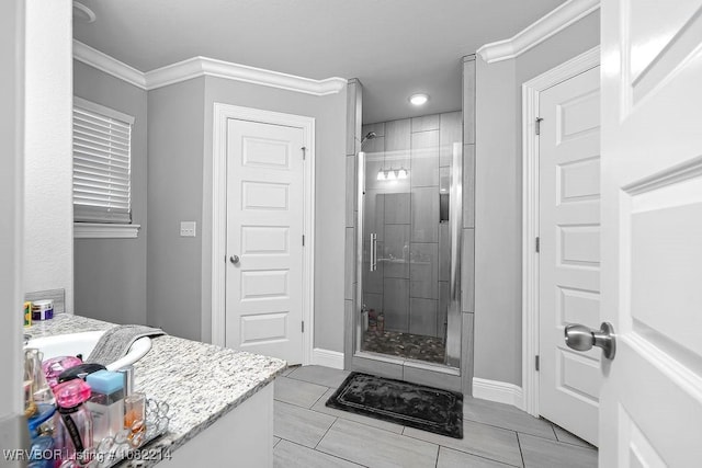1024 Mourning Dove Way, Barling, AR 72923 - full bath with a stall shower, ornamental molding, tile patterned flooring, and vanity