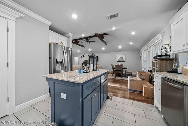 1024 Mourning Dove Way, Barling, AR 72923 - kitchen with appliances with stainless steel finishes, white cabinets, a ceiling fan, blue cabinetry, and recessed lighting