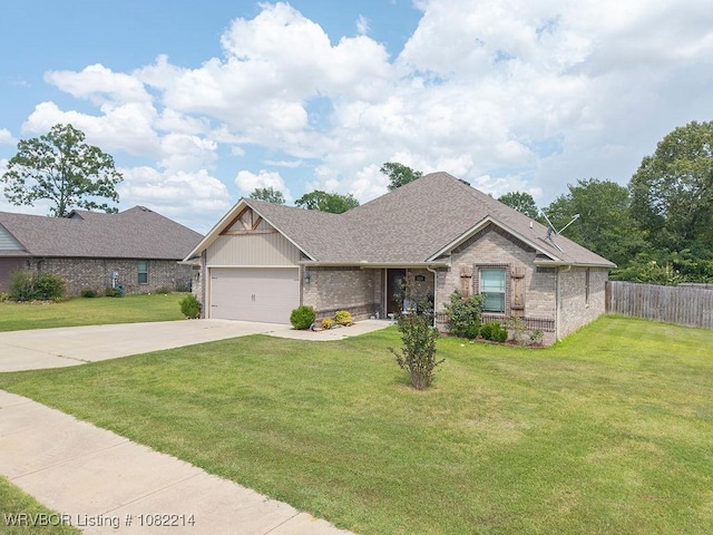 1024 Mourning Dove Way, Barling, AR 72923 - view of front of home featuring brick siding, driveway, a garage, and a shingled roof