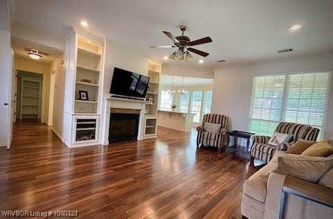 living area featuring recessed lighting, ceiling fan, wood finished floors, and a fireplace