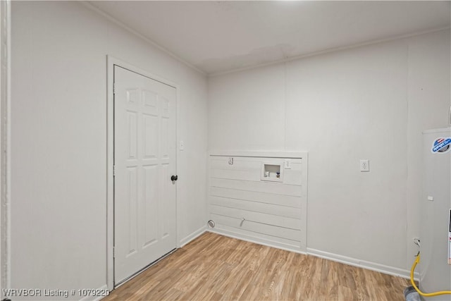 laundry room with baseboards, laundry area, washer hookup, and light wood-style floors