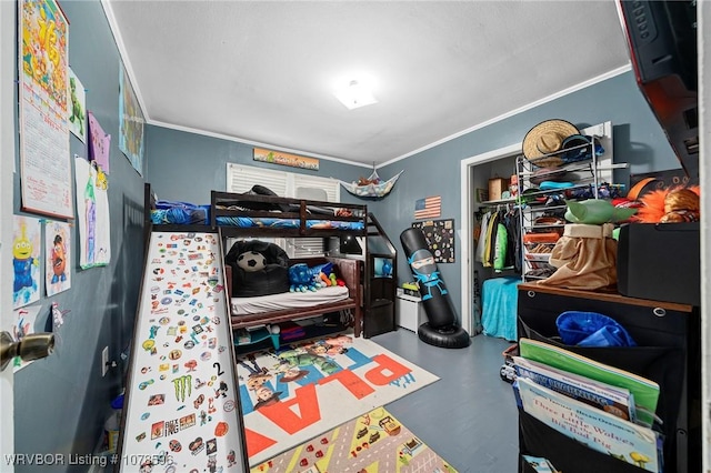 bedroom with crown molding and concrete floors