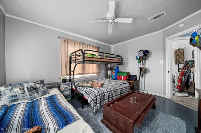 bedroom with ceiling fan, ornamental molding, and wood-type flooring