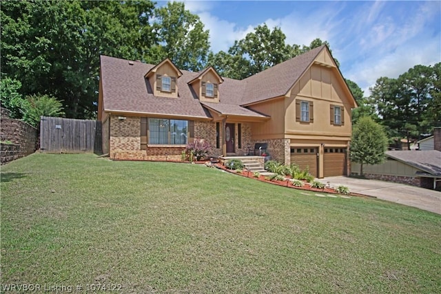 view of front of house featuring a front yard and a garage