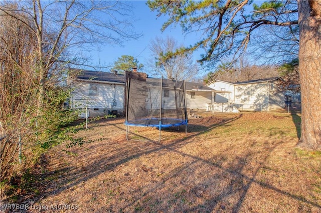 view of yard featuring a trampoline