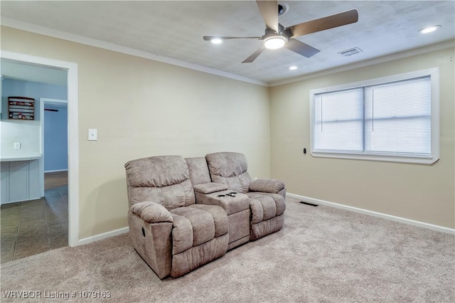 living area featuring carpet, crown molding, visible vents, and baseboards