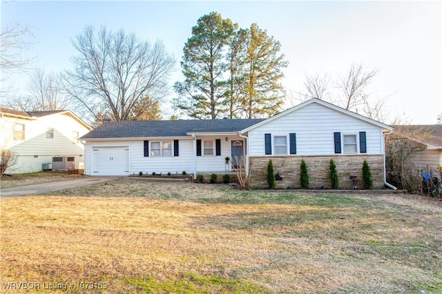 ranch-style house featuring driveway, a front lawn, an attached garage, and stone siding