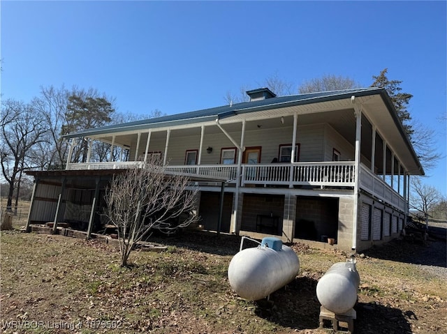 rear view of house with covered porch