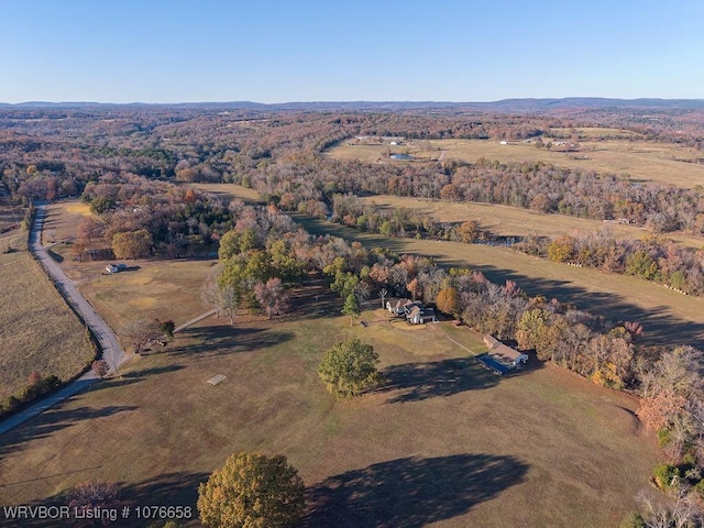 birds eye view of property with a rural view