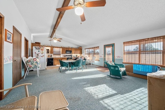 carpeted living room with vaulted ceiling with beams, ceiling fan, and a textured ceiling