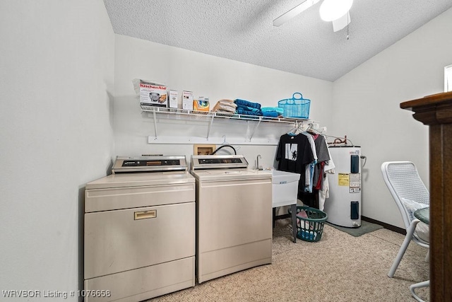 washroom with washer and clothes dryer, ceiling fan, electric water heater, and a textured ceiling