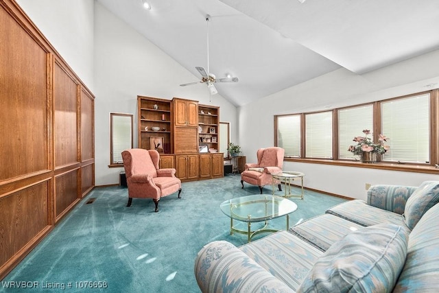 living room with ceiling fan, carpet floors, and high vaulted ceiling