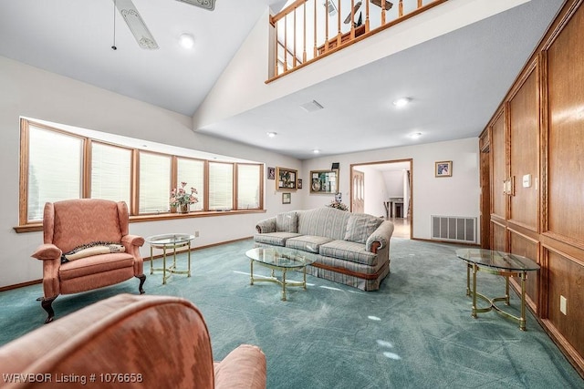 living room with carpet flooring, ceiling fan, and a wealth of natural light