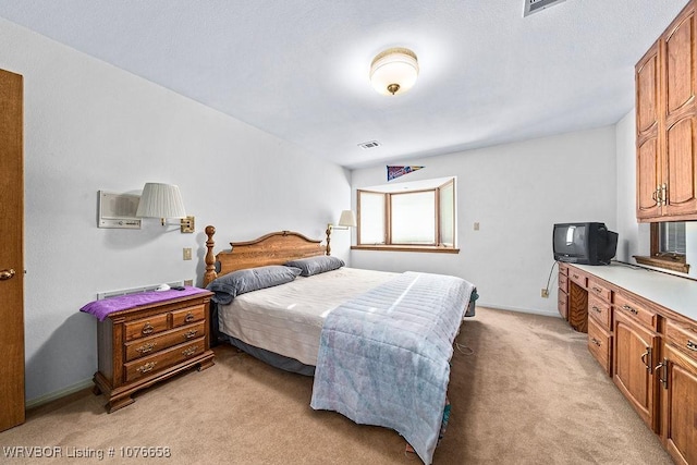 bedroom with light carpet