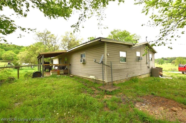 view of side of home with cooling unit