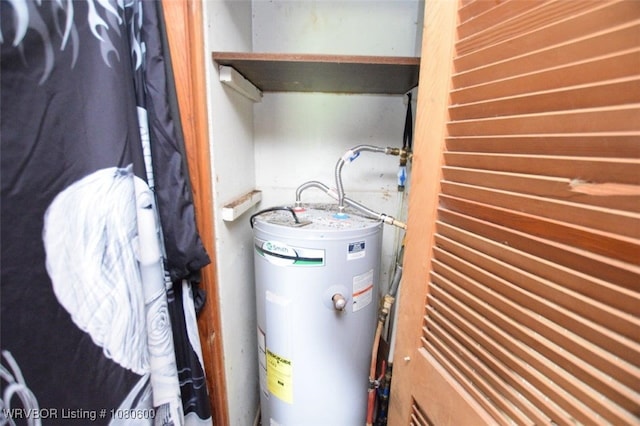 utility room featuring water heater