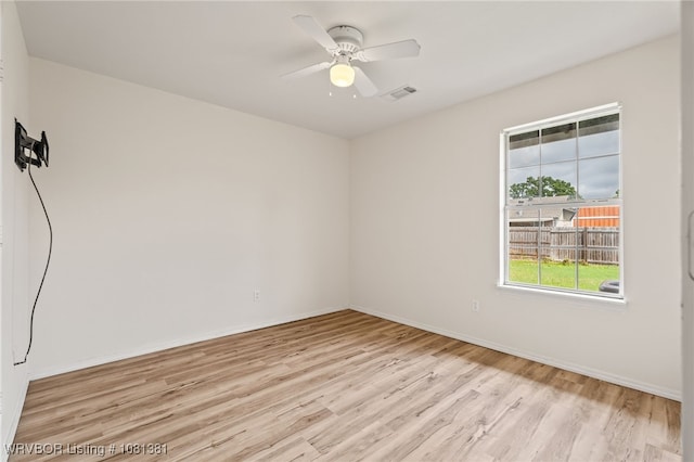 101 Saskatchewan Rd, Roland, OK 74954 - unfurnished room with light wood-style floors, baseboards, and ceiling fan