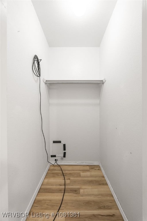 101 Saskatchewan Rd, Roland, OK 74954 - laundry room featuring light wood-type flooring and baseboards