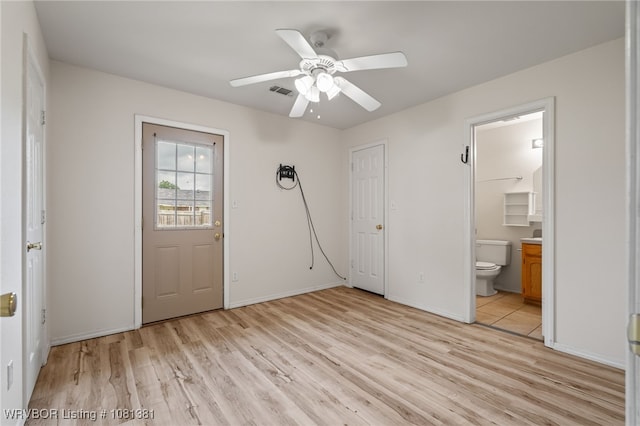 101 Saskatchewan Rd, Roland, OK 74954 - unfurnished bedroom with light wood-type flooring, ensuite bath, baseboards, and ceiling fan