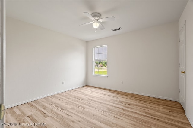 101 Saskatchewan Rd, Roland, OK 74954 - empty room with a ceiling fan, light wood finished floors, and baseboards