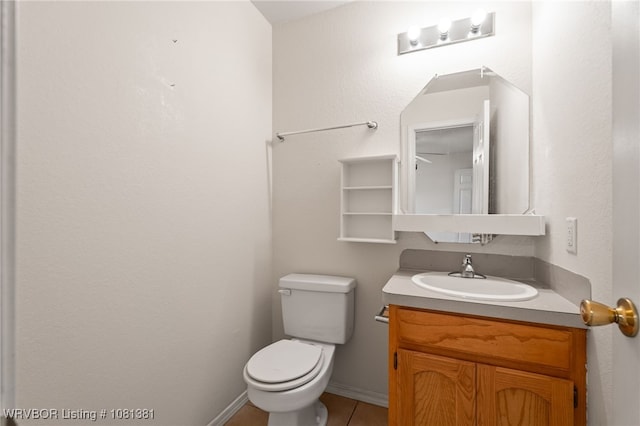 101 Saskatchewan Rd, Roland, OK 74954 - half bathroom with vanity, toilet, and tile patterned floors