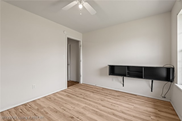 101 Saskatchewan Rd, Roland, OK 74954 - spare room featuring wood finished floors, ceiling fan, and baseboards
