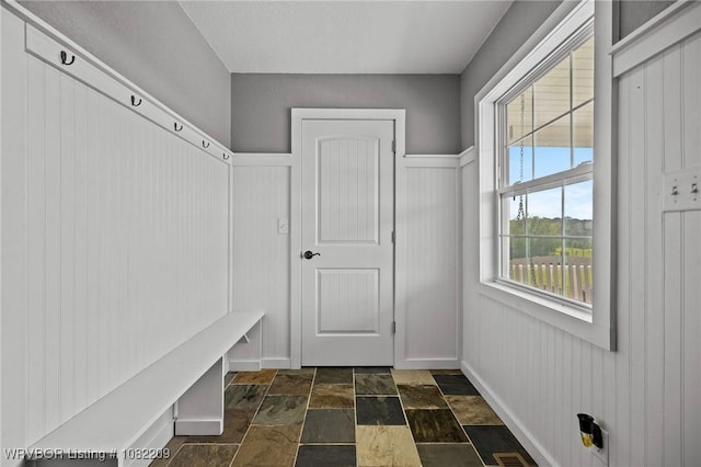 6106 Dean Rd, Alma, AR 72921 - mudroom with dark stone finish flooring and baseboards