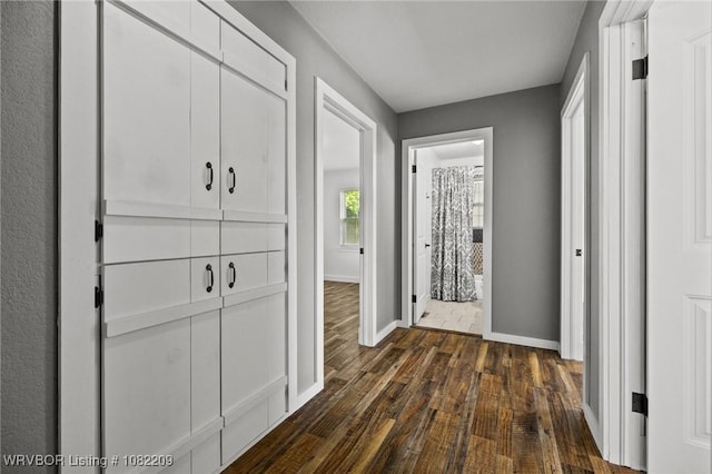 6106 Dean Rd, Alma, AR 72921 - hallway featuring dark wood-style flooring and baseboards