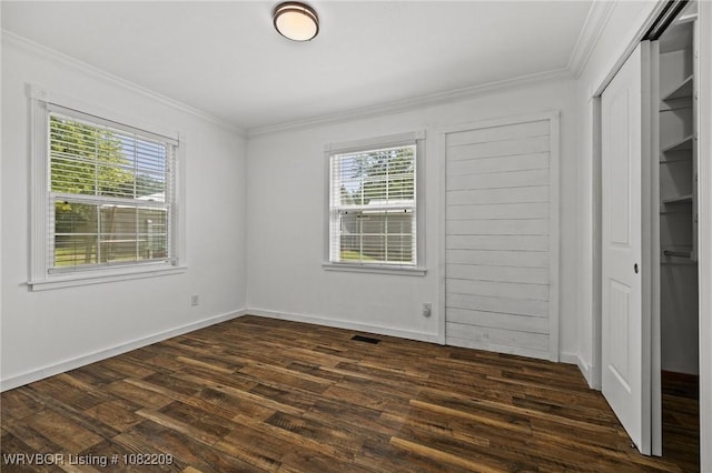 6106 Dean Rd, Alma, AR 72921 - unfurnished bedroom featuring ornamental molding, dark wood finished floors, and a closet
